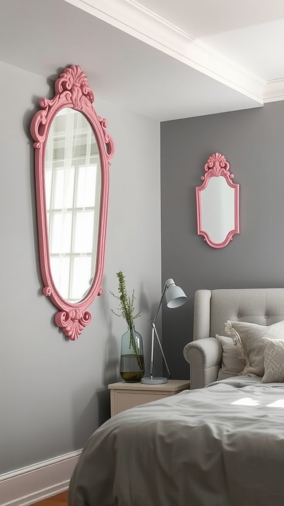 A grey bedroom featuring pink decorative mirrors, one large and ornate, and another smaller, adding a stylish touch.